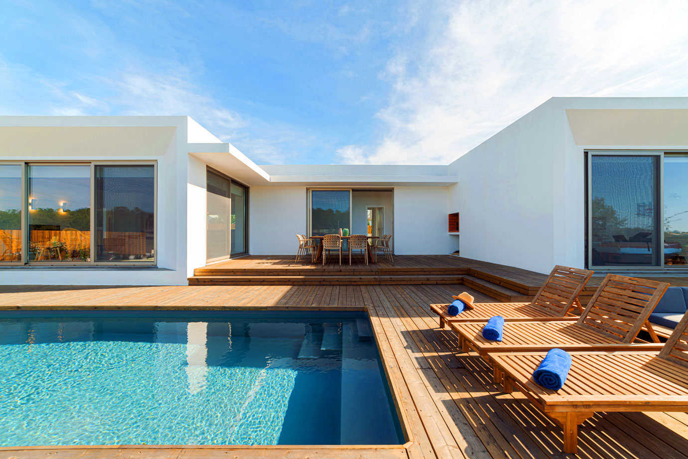 lounge-chairs-in-modern-villa-pool-2021-08-28-10-00-39-utc.jpg